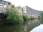 Old stone built mill or warehouse in need of refurbishment