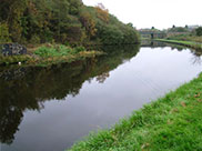 Wide stretch of canal and old construction on other side