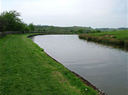 The canal winds through the hills