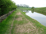 The canal winds through the hills