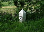 Damaged mile marker, 30¼ miles to Leeds