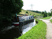 A narrowboat passes Buck Hill swing bridge