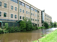 Modern buildings opposite the old houses