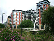 New buildings and a footbridge over the River Aire