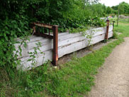 Large boards of wood to make service dam