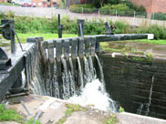Water overflowing the lock gates at lock 55