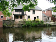 Old house engulfed by modern development