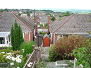 A view of rooftops from the towpath at Whittlefield